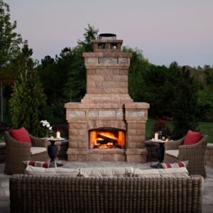 Outdoor fireplace from Belgard elements collection on beautiful outdoor patio setting
